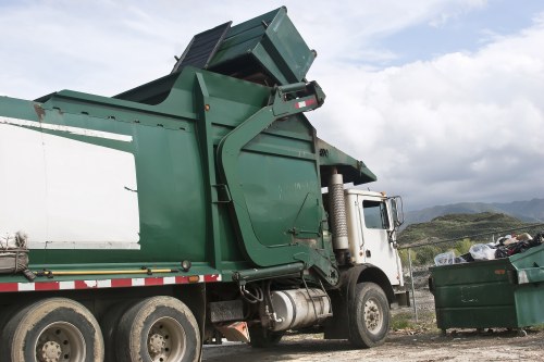 People disposing old furniture in Richmond recycling center