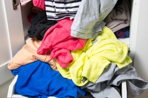 Inspector reviewing garden clearance site and taking notes