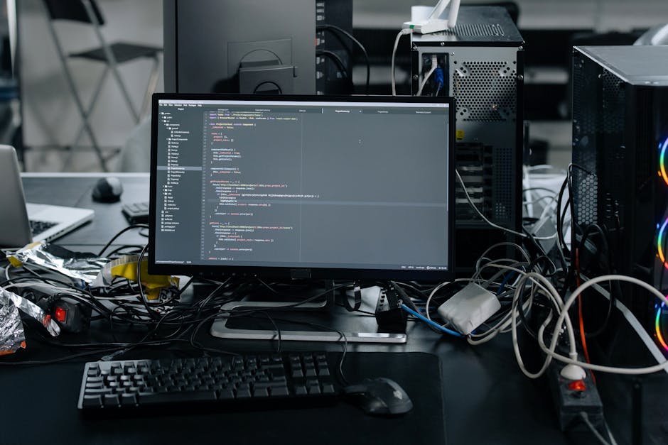 This image displays a computer screen with lines of HTML code, including tags such as <head>, <meta>, and <link>, with the code highlighted in various colors like blue, red, and green, indicative of a